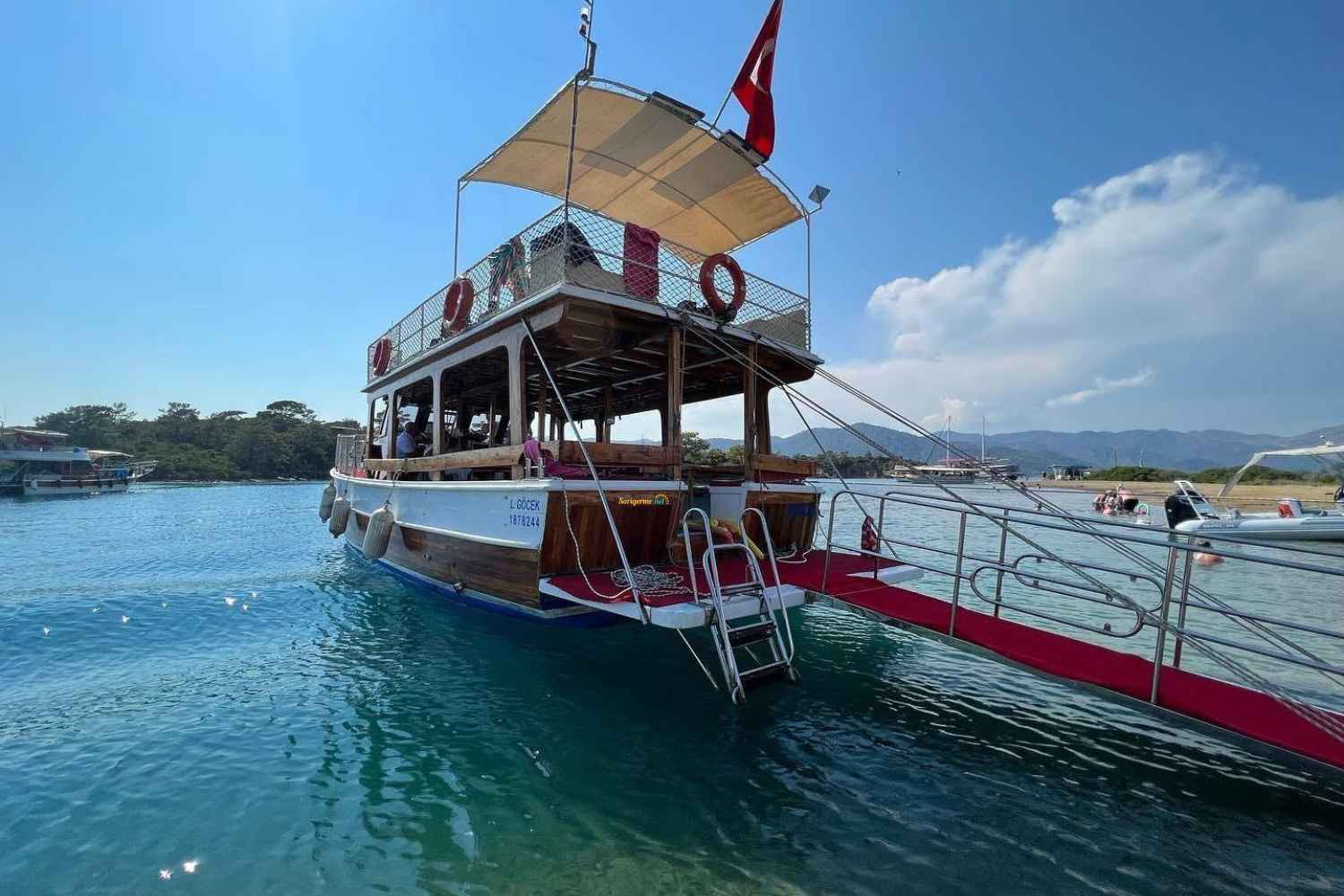 12 Island Boat Trip in Gocek Bays. Pick up from Sarigerme Dalaman. Double Decker Boat has easy access Ladder, Shower and Toilets. Return Transfer from all hotels is included as well as Lunch.